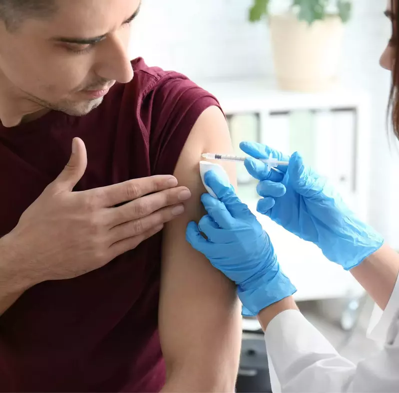 doctor giving vaccine shot